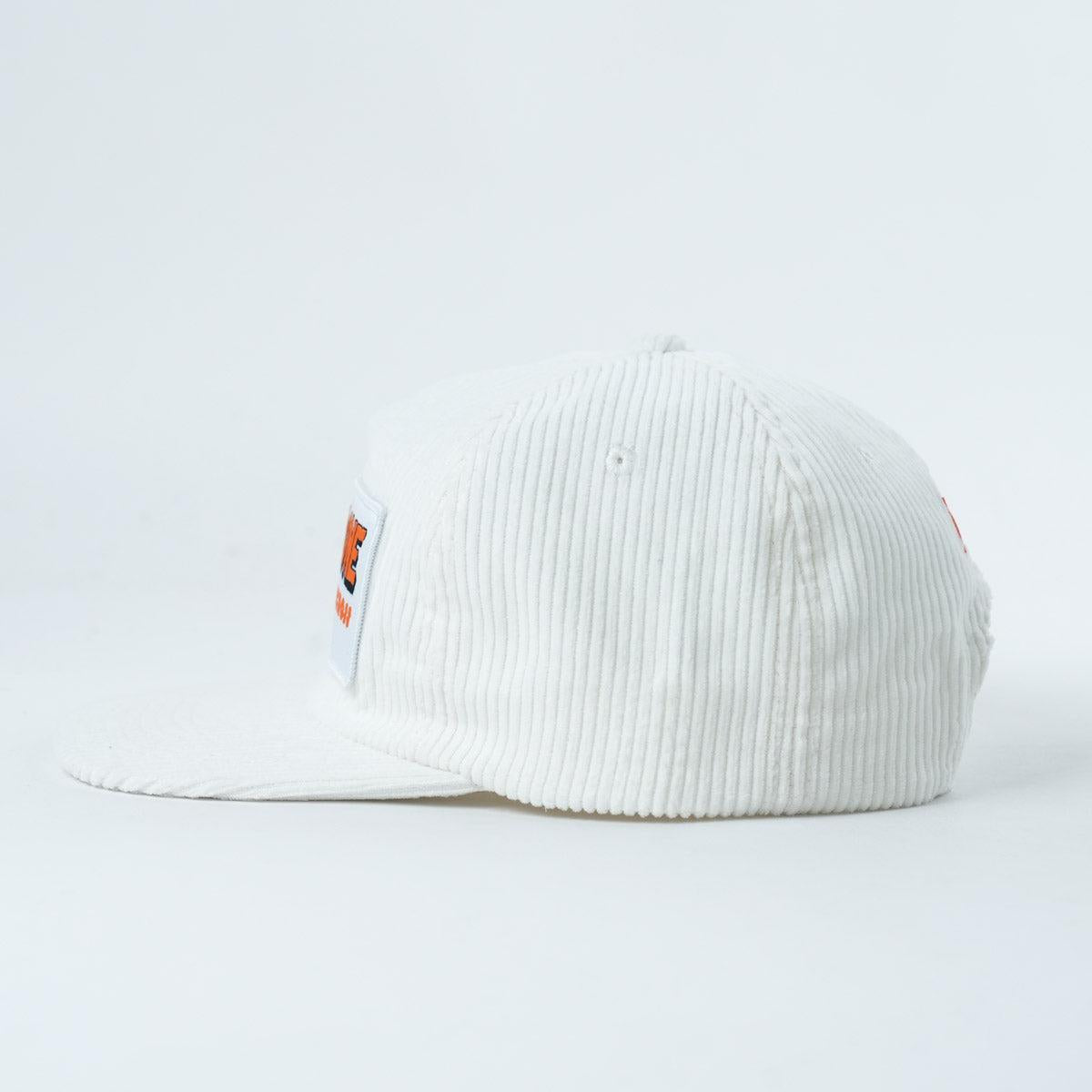 The Backbone 5 Star Snapback Hat is a white corduroy 5 panel cap with a flat brim, shown from the side and featuring a small rectangular patch on the front—ideal for fans of Backbone BMX.