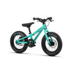The Radio Zuma 14 Inch Bike, a turquoise kids’ mountain bike with thick black tires, a black seat, and straight handlebars, is displayed against a white background.