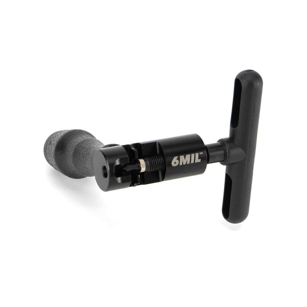 The 6MIL CB-02 Chain Breaker is a black, workshop-grade handheld tool with a T-shaped handle and textured grip, designed for tightening or loosening BMX-style chains.