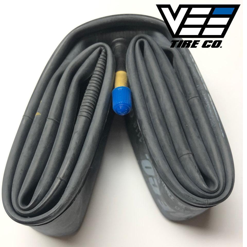 The Vee 24 Inch Tube (Schrader Valve), a coiled latex inner tube sized 24 x 1.50-24 x 2.25 with a visible Schrader valve and blue cap, is displayed next to the Vee Tire Co. logo in the top right corner.
