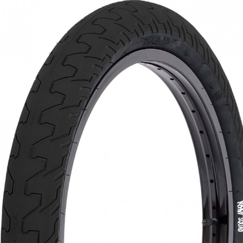 Close-up of the Rant Squad 16 Inch Tyre in black, mounted on a rim and showing its micro knurled tread and detailed sidewall—ideal as an all-around BMX tire.