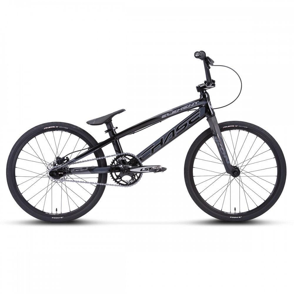 The Chase Element Expert Bike, featuring a black BMX design with an Expert XL frame, lightweight build, flat handlebars, thin saddle, and knobby tires on both wheels. The bike is displayed in a profile view against a white background.