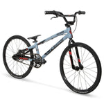 The Chase Edge Expert Bike (2026) is a light blue BMX race bike with black and red accents, thin tires, a small seat, high handlebars, and a durable 6061 aluminum frame, shown against a white background.