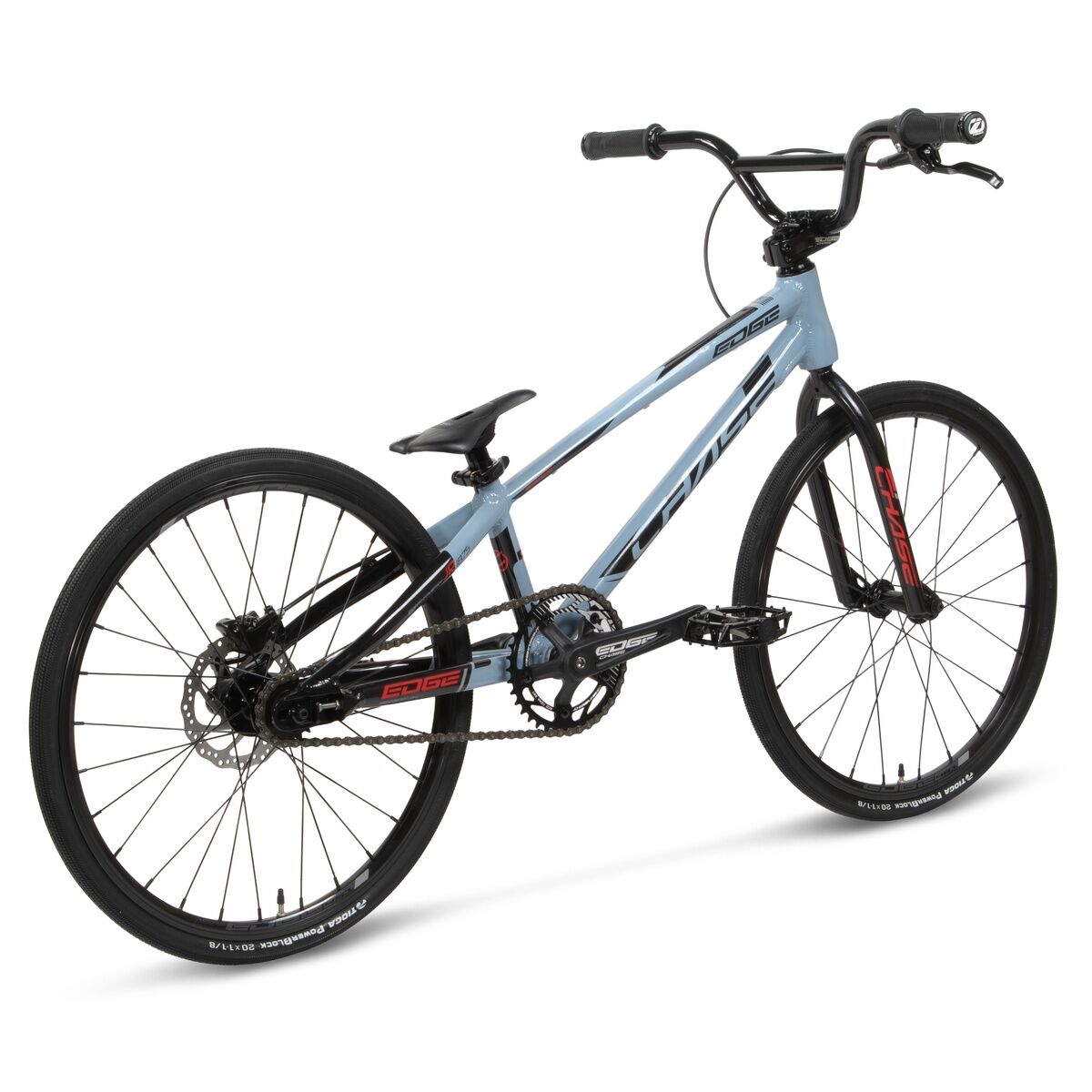 The Chase Edge Expert Bike (2026) is a light blue BMX race bike with a 6061 aluminium frame, black wheels and seat, plus red and black detailing, shown from the rear-right angle on a white background.