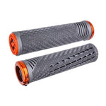 A pair of performance driven ODI CF Lock On Grips V2.1 in grey and orange on a white background.