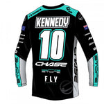 The Chase Izaac Kennedy 2024 Team Replica Jersey is a black and teal BMX racing jersey with "Kennedy," number 10, and sponsor logos—perfect for fans and riders seeking an authentic team look.