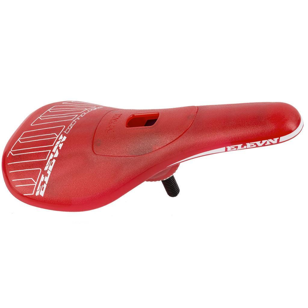 A red Elevn Pivotal Pro Seat with white graphics and "ELEVN" branding on the side, shown angled—ideal as a lightweight Pivotal Expert seat upgrade for your BMX.