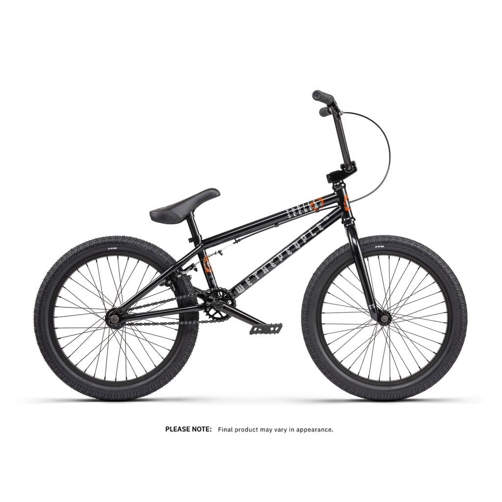 Side view of the Wethepeople Thrillseeker 20 Inch Bike—a freestyle BMX with thick tires, padded seat, straight handlebars, and foot pegs—displayed against a white background.