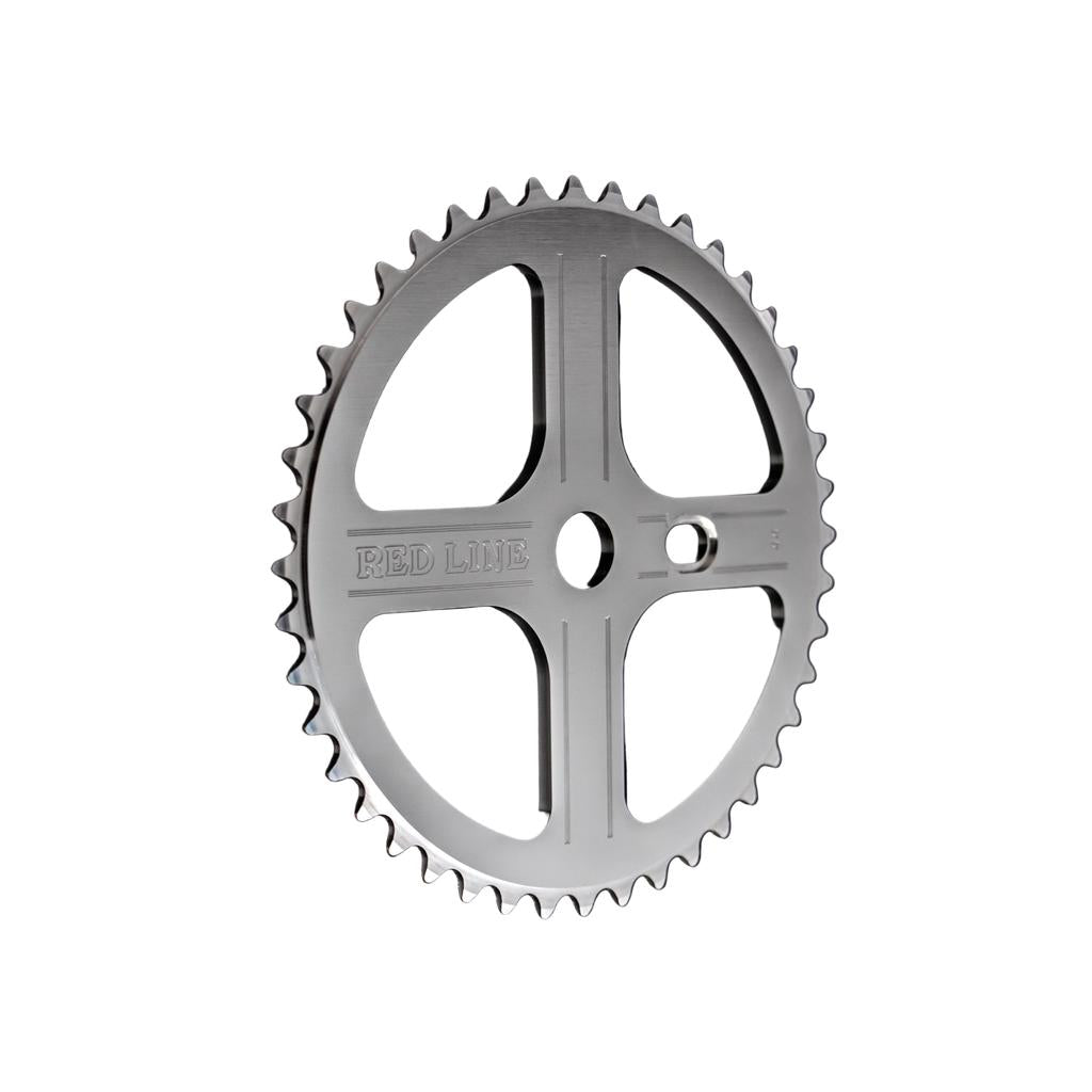 The REDLINE Flight Front Sprocket is a metal chainring with four cut-out spokes, evenly spaced teeth, and "RED LINE" engraved on the face—perfect for vintage BMX drivetrains.