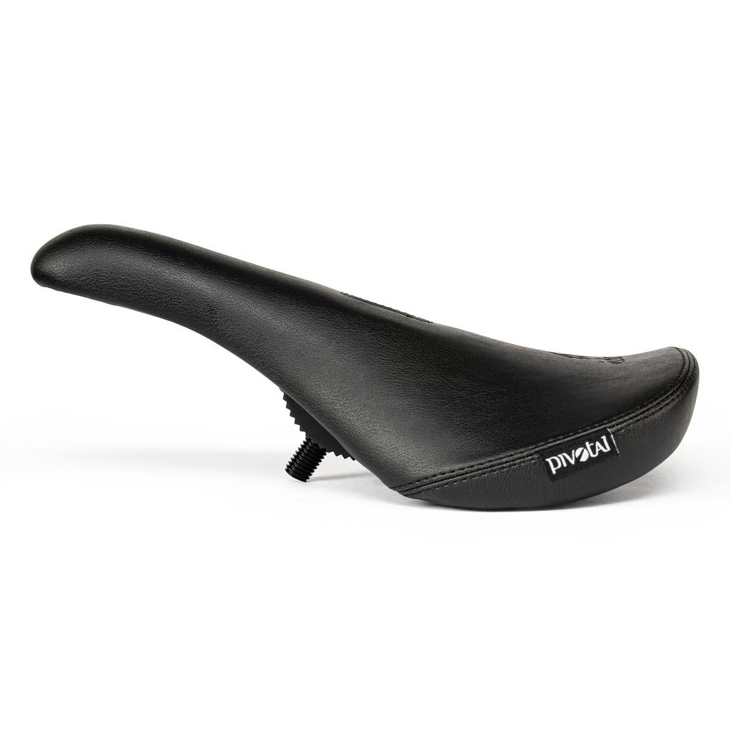 The Eclat Exile Pivotal Seat features a textured black surface and visible screw, offering ergonomic comfort for BMX bikes; shown here against a white background.