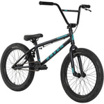 The Raven Trickster 20 Inch Bike is a black entry-level BMX with teal "RAVEN" and "TRICKSTER" branding, thick tires, and a padded seat, shown on a white background—ideal for beginner BMX riders.
