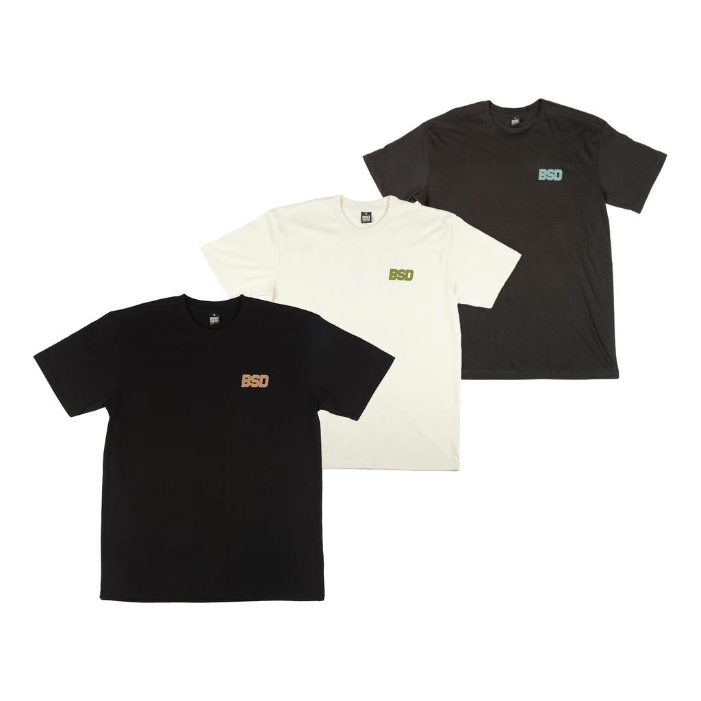 Three BSD We Here Forever T-Shirts in black, white, and dark grey, each with a small "BSD" logo on the left chest.