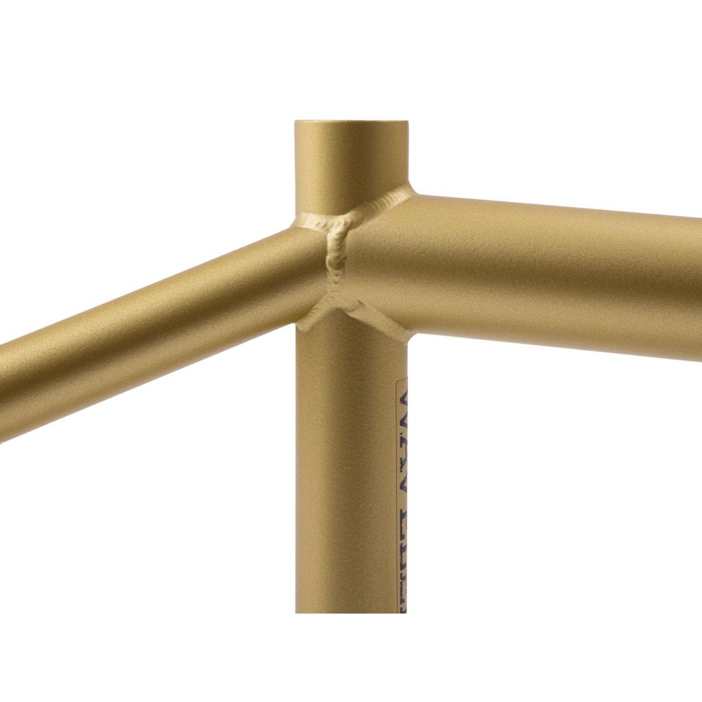 Close-up of a gold-colored Sunday Wavelength Frame, highlighting the welded joints where the top tube, seat tube, and seat stay meet.