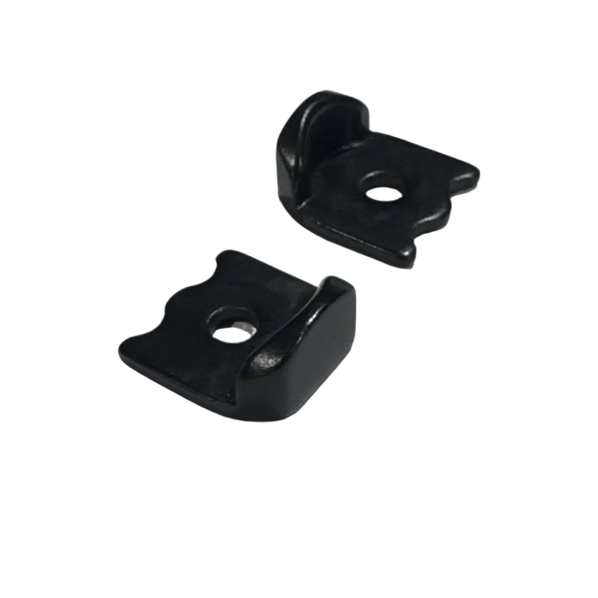 Two small black metal brackets with contoured edges, raised sides, and a central mounting hole are shown on a white background. Part of the Meybo Holeshot Chain Tensioner Kit 10mm Axle for 10mm Drop Outs, these brackets provide precise chain adjustment and reliable performance for Meybo Holeshot frames.