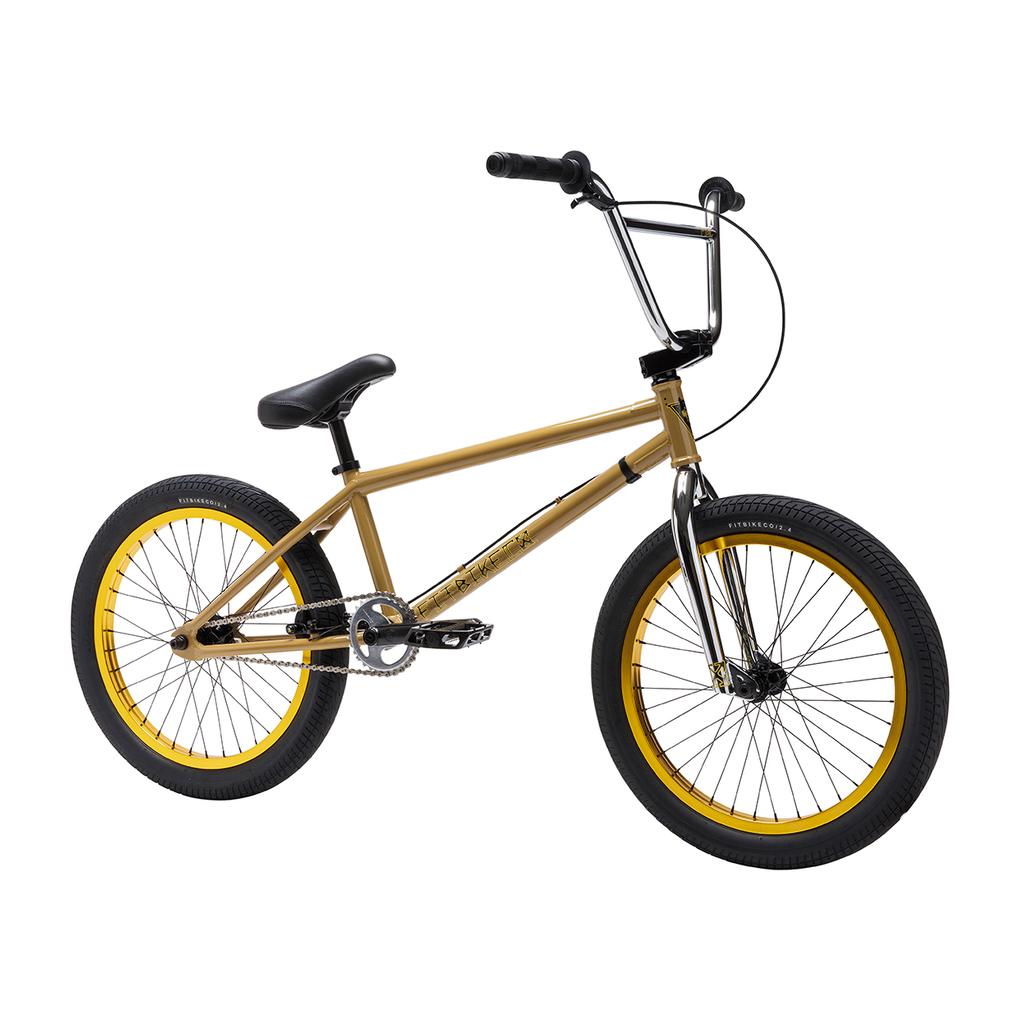 The Fit Bike Co Nightwolf 20 Inch Bike is a limited edition gold BMX with a black seat, handlebars, and tires, yellow wheel rims, and minimal branding—no extra accessories or decals beyond the brand logo on the frame.