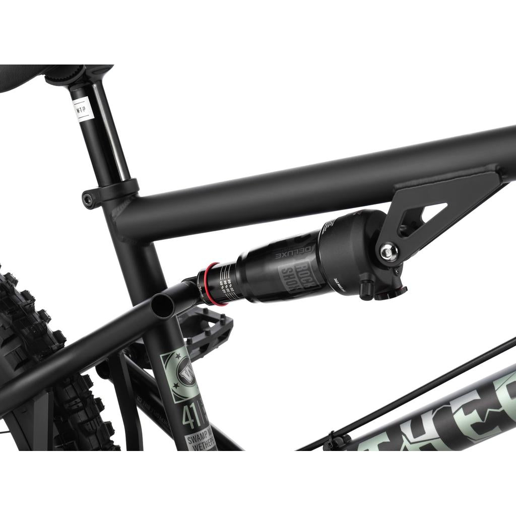 Close-up of the matte black Wethepeople Swampmaster 20 Inch Bike frame featuring a rear suspension shock absorber.