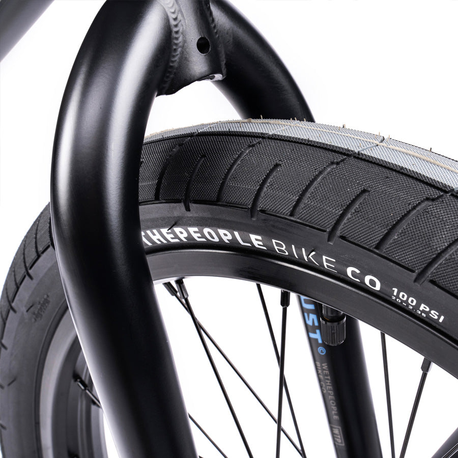 A close up of a black Wethepeople Trust 20 Inch Freecoaster Bike tire.