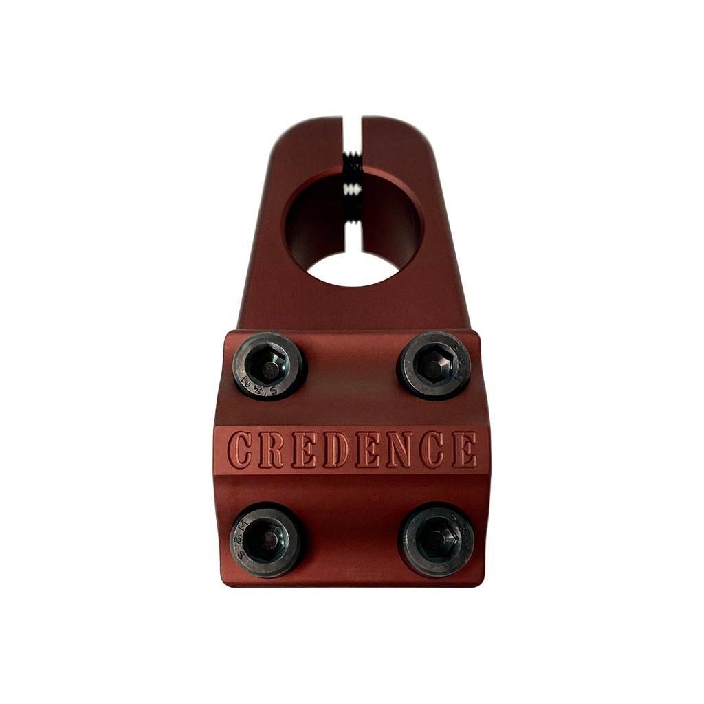 A red metal S&M Turtleneck Stem, featuring a 52mm reach, four hex bolts, and "CREDENCE" engraved on the front.