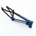 The Staystrong V5 Disc Junior Frame, in blue and black with "STAYSTRONG" branding, is an aluminium race frame designed for disc brake compatibility and shown on a white background.