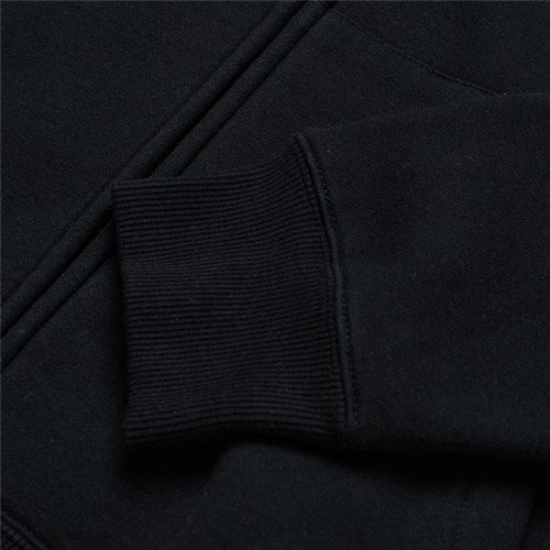 Close-up of the TLD 25.1 Signature Zip Up Hoodie's sleek black sleeve with a ribbed cuff in soft fabric, ideal for the cold season.