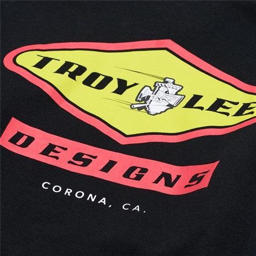 The TLD 25.1 Carb Hoodie features the vibrant yellow and red "Troy Lee Designs" logo with "Corona, CA" elegantly scripted at the bottom, making it perfect for any TLD enthusiast. It's versatile and ideal for layering during chilly winter days.