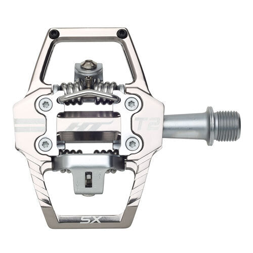 A close-up shows the HT T2-SX Clip In Pedals in silver, featuring a durable clipless spring mechanism and a threaded spindle for easy mountain bike attachment.