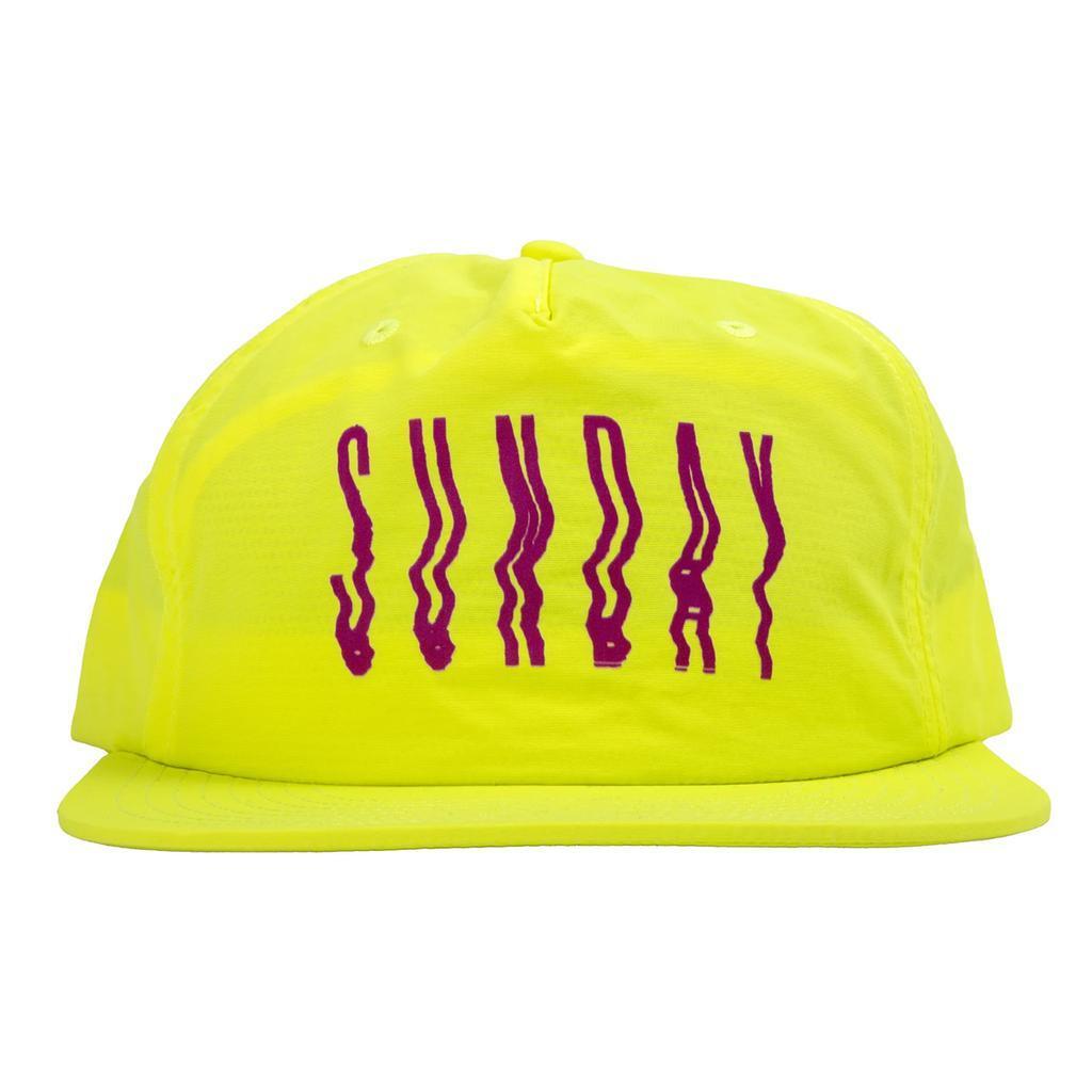 The Sunday High Wave Cap is a bright yellow snapback from Sunday Caps, featuring "SUNDAY" in bold distorted purple letters—an ideal choice for your Back to School 2025 style.