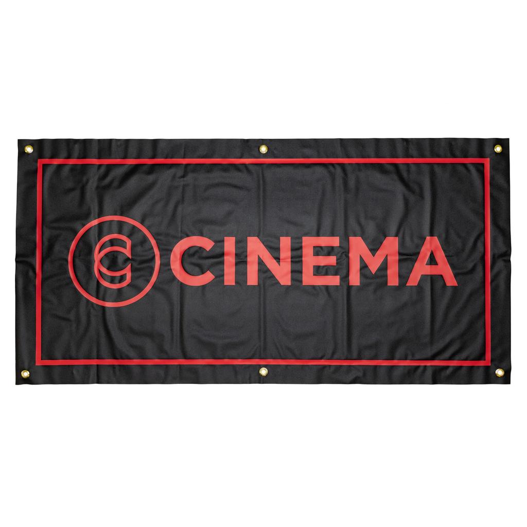 The Cinema Hanging Wall Banner features heavy-duty vinyl, a black background with red border, bold "CINEMA" lettering, and a circular logo on the left. Four metal grommets in the corners make it perfect for stylish room decor.