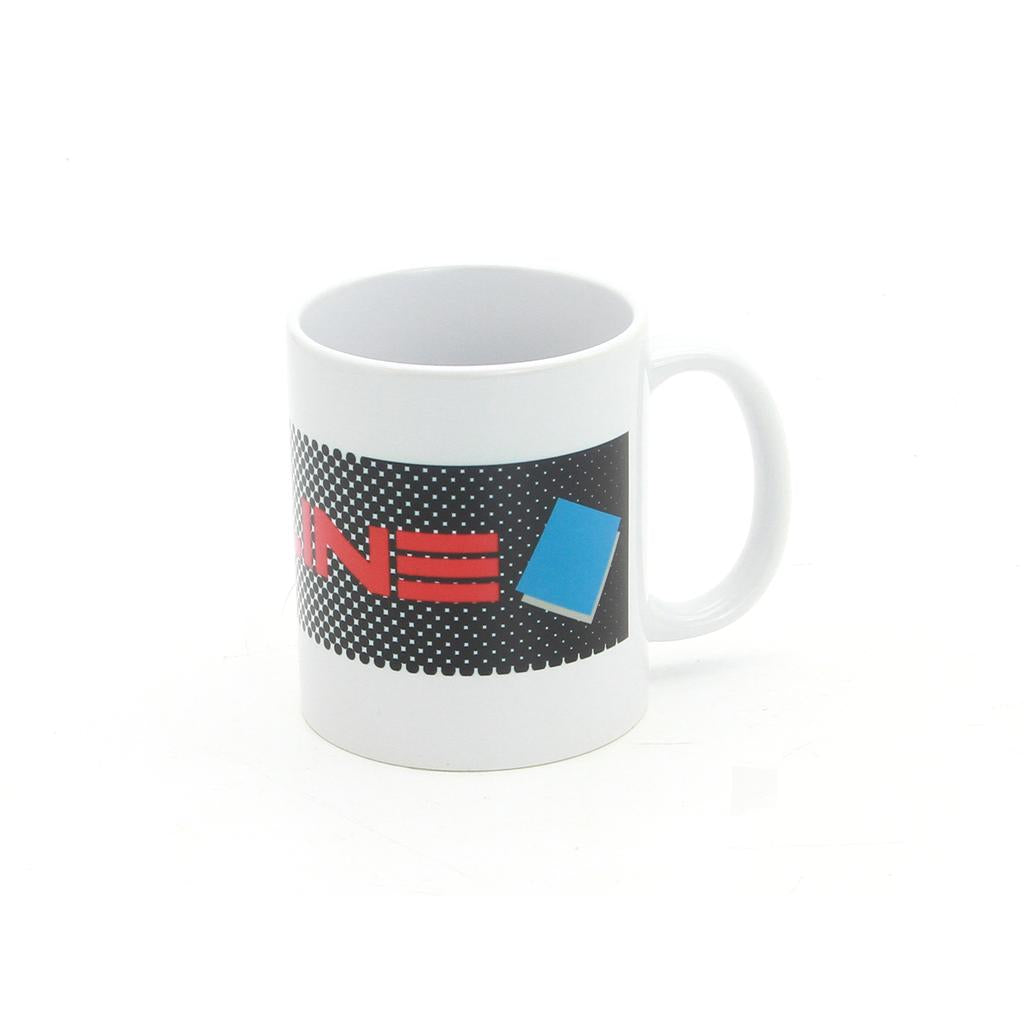 The Redline RL20II Coffee Mug is a white 12oz mug with a handle, featuring a striking black, redline, and blue geometric design on its side.