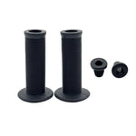 A pair of black DRS Mushroom Grips with a classic mushroom design and flange, plus two matching black bar end plugs, displayed on a white background.