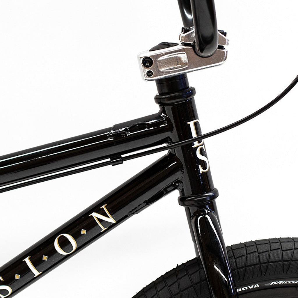 A close up of a black Division Reark 20 Inch Bike with Division Reark and 3-piece cranks.