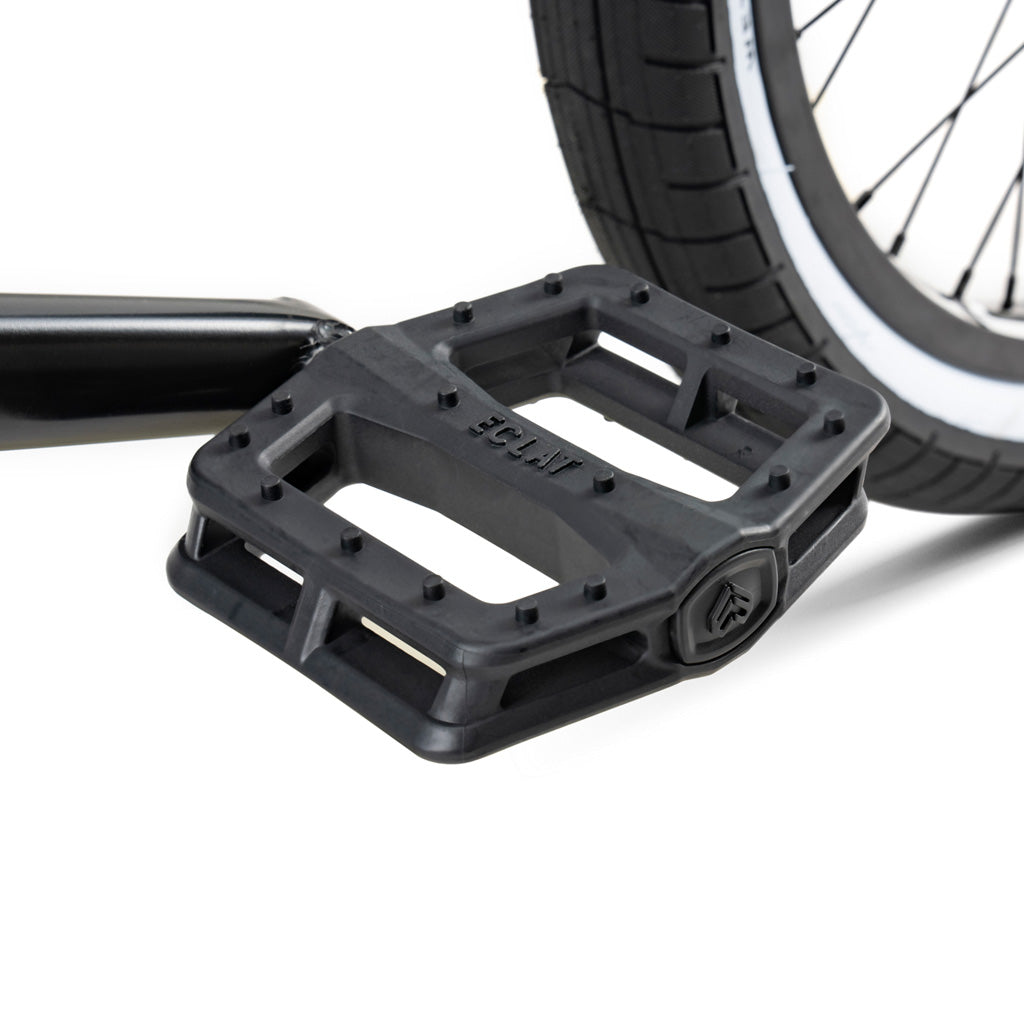 A Wethepeople Battleship 20 Inch BMX Bike pedal paired with a black tire.