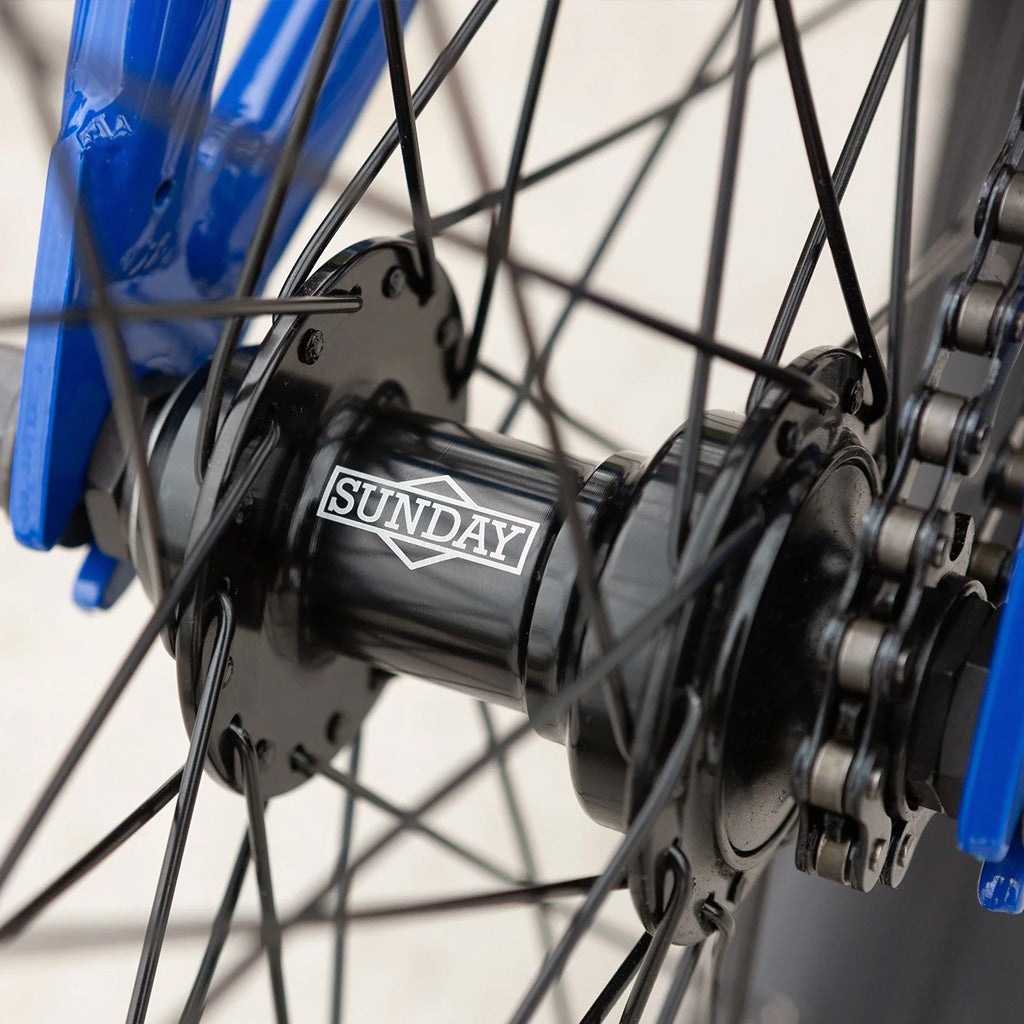 A close up of a Sunday Blueprint 20 inch Bike wheel with a black spoke.