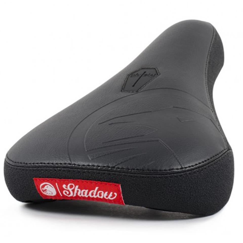 Shadow Crow'd Pivotal Seat features a textured synthetic leather surface, subtle embossed design, and a red side tag labeled "Shadow.