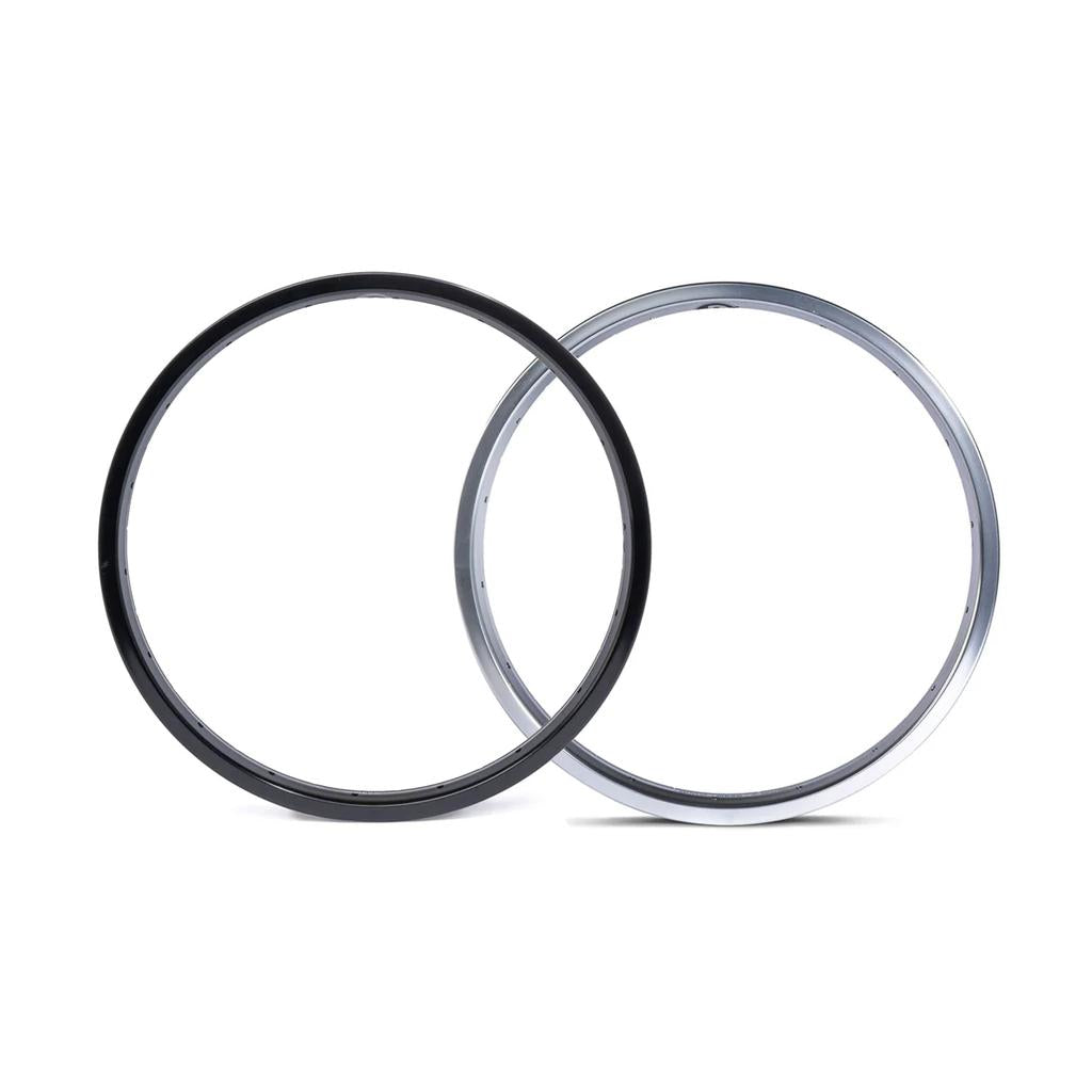 Two Salt Mesa 18 Inch Rims, made from durable 6061-T6 alloy, one in black and the other in silver, stand upright side by side against a white background.
