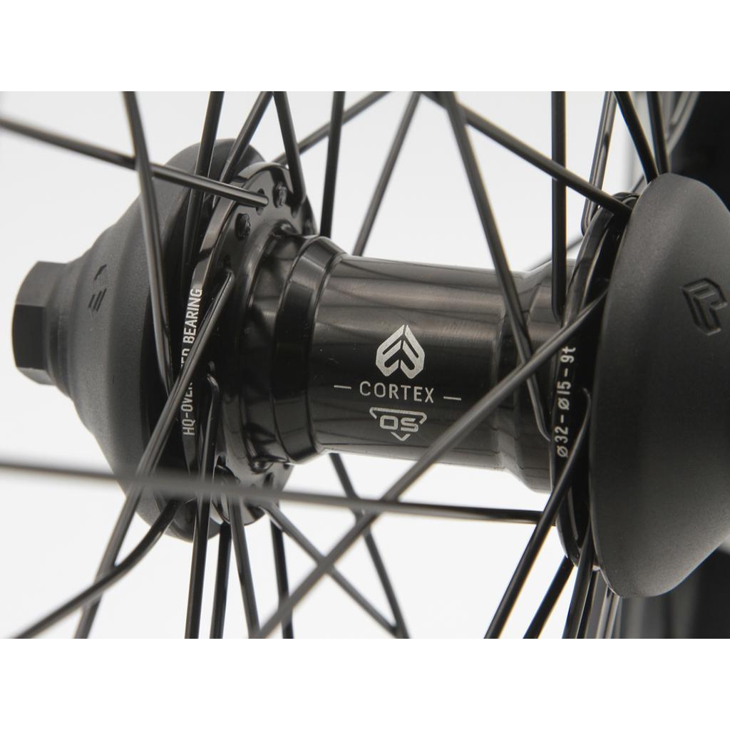 Close-up of the Eclat Cortex OS X Bondi Logo Front Wheel, featuring a black hub with visible logo and bearing specs, and stainless steel spokes radiating outward from the hub.
