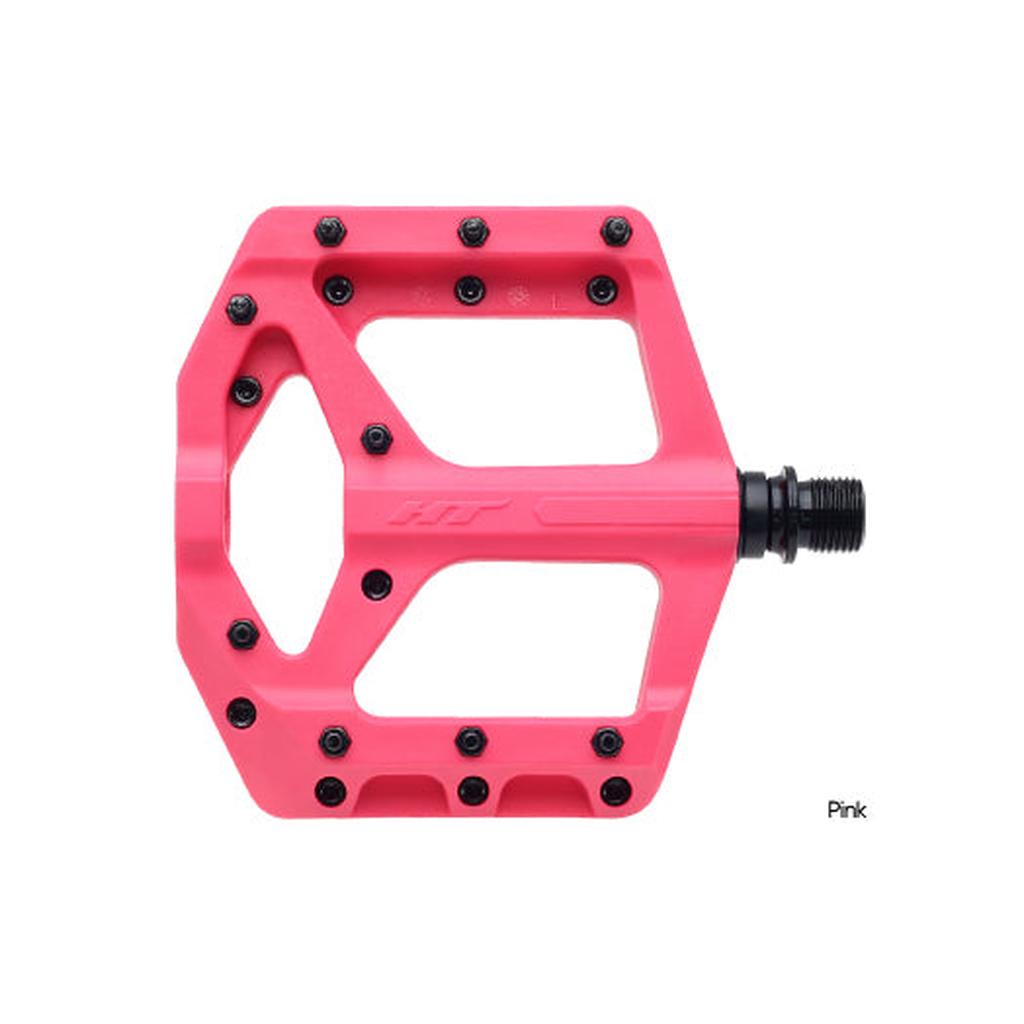 The HT Components Supreme C PA32A Pedals are pink flat pedals featuring a traction platform, multiple metal and replaceable grip pins for extra hold, plus a black spindle for secure attachment.