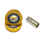 Two gold-colored BMX bottom bracket bearings labeled "S&M Bikes Made in USA" are stacked beside a metallic spacer—a quality S&M USA Bottom Bracket Set built for lasting durability.