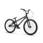 The Radio Helium Pro 24 Inch Cruiser Bike is a black BMX race cruiser with a lightweight frame, flat handlebars, slim tires, and a single gear, shown on a white background.