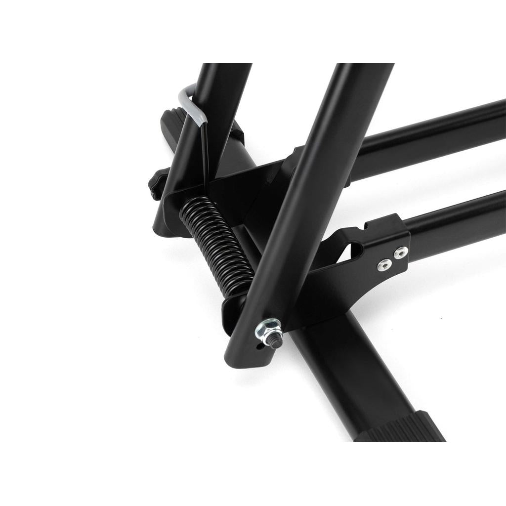 Close-up view of the 6MIL BS-01 Bike Stand’s black metal folding mechanism, featuring a spring and bolts for durable support.