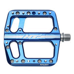 The HT Components ANS12 Raven Pedals are blue aluminum platform pedals with a large cutout design, multiple replaceable grip pins, and the "Raven" branding—ideal flat bike pedals for cyclists seeking reliability.