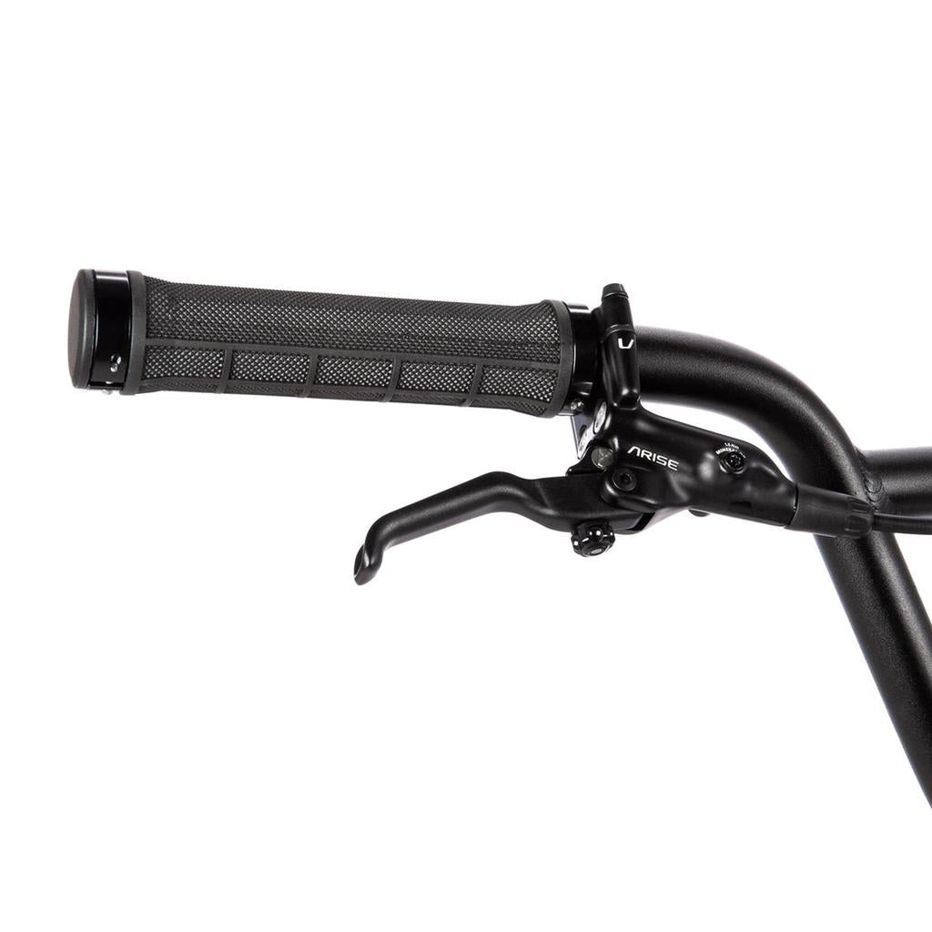 Close-up of the Radio Xenon Expert XL Disc 20 Inch Bike's black handlebar with a textured rubber grip, a high-performance brake lever, and part of the “ARISE” logo visible on the brake assembly.
