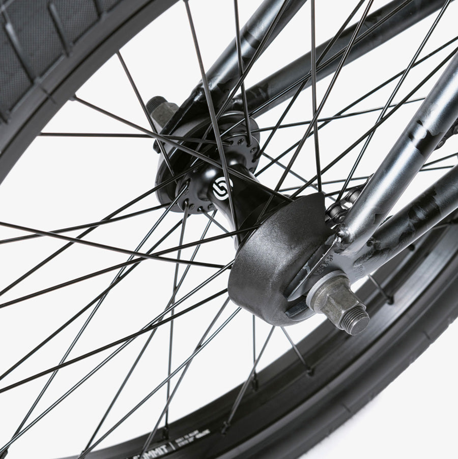 A close up of a Wethepeople Justice 20 BMX Bike wheel, an urban machine.