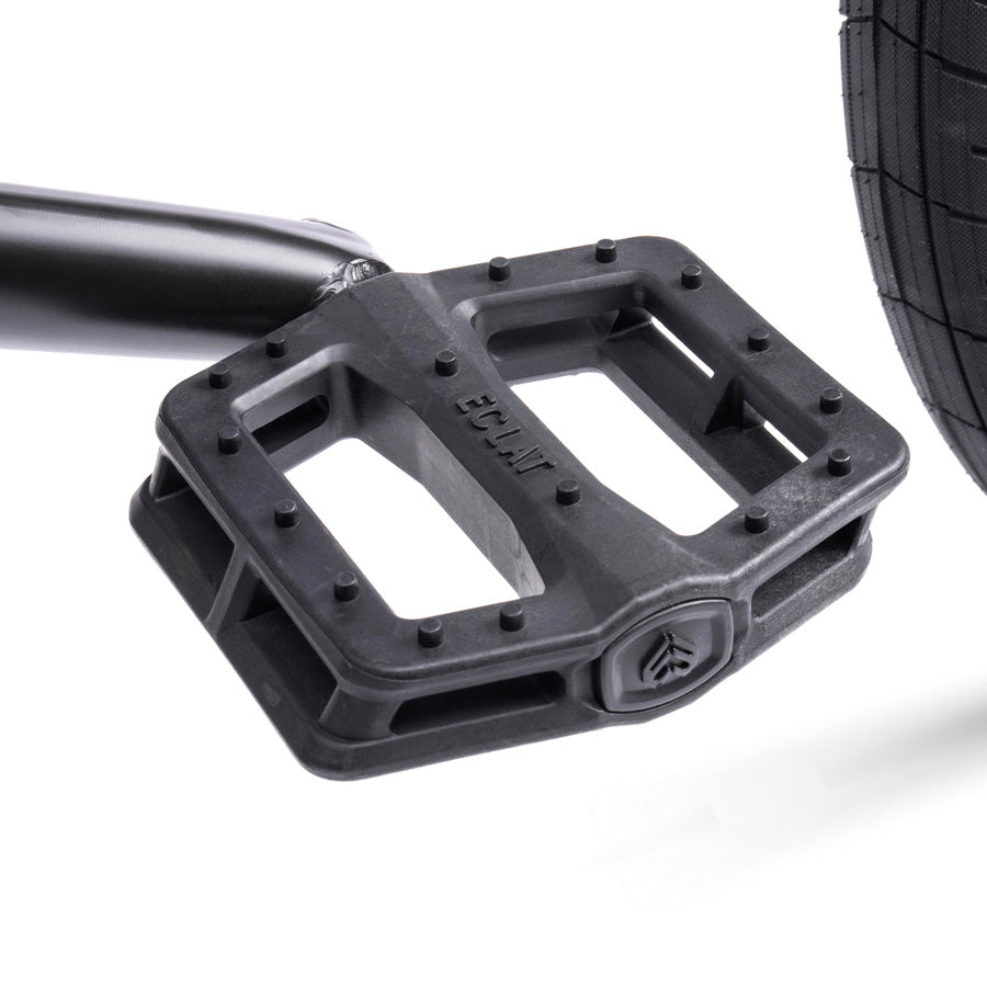 A close up of a black pedal on a white background featuring a Wethepeople Trust 20 Inch Freecoaster Bike.