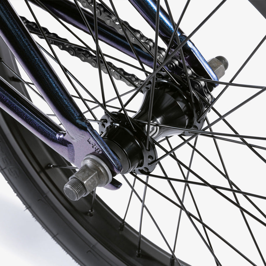 A close up view of a purple Wethepeople CRS 18 Inch BMX Bike wheel.