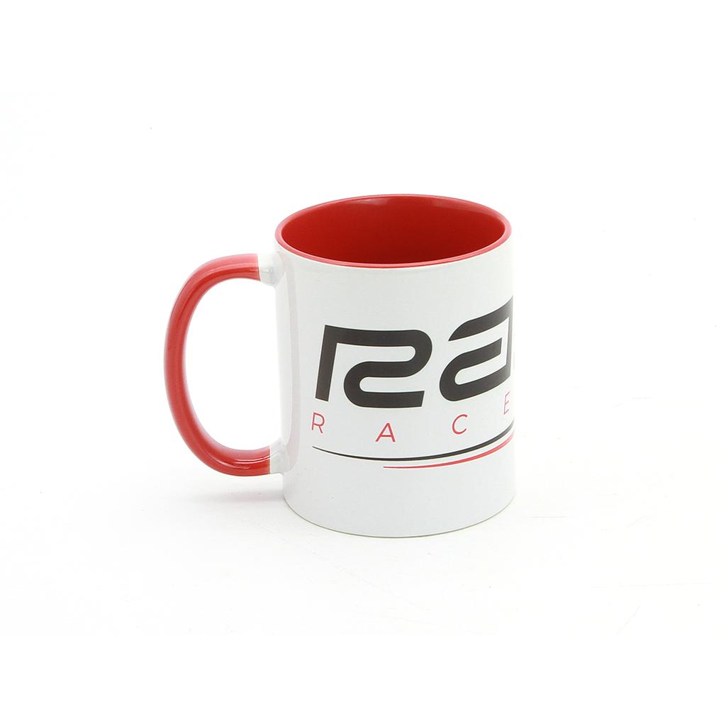 The Radio Raceline Coffee Mug is a 12oz white ceramic mug with a red interior and handle, featuring black and red text and design. Shown on a white background, it's perfect for fans of radio or unique track mugs.