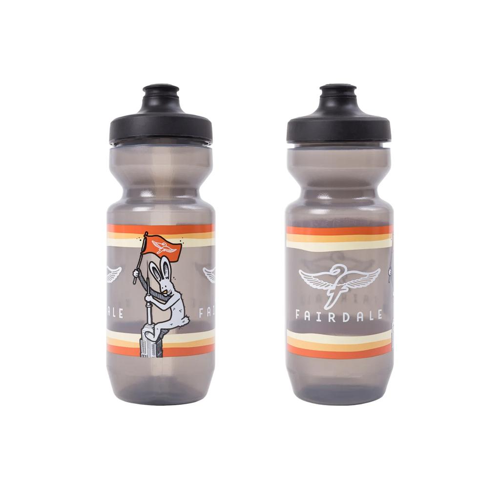 Two translucent Fairdale Elevator Water Bottles with black caps; one side shows a cartoon rabbit holding a flag, the other displays the Fairdale logo and text. BPA-free design ensures safe, clean hydration.