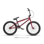 A Wethepeople Thrillseeker 20 Inch Bike in red, featuring black handlebars, seat, and tires, is displayed in a side profile against a white background.