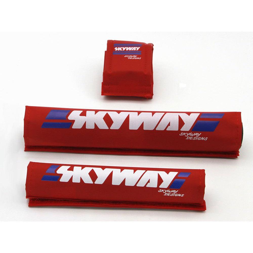 A set of red, blue, and white SKYWAY USA Made Retro Pad Sets with the word Skyway on them.