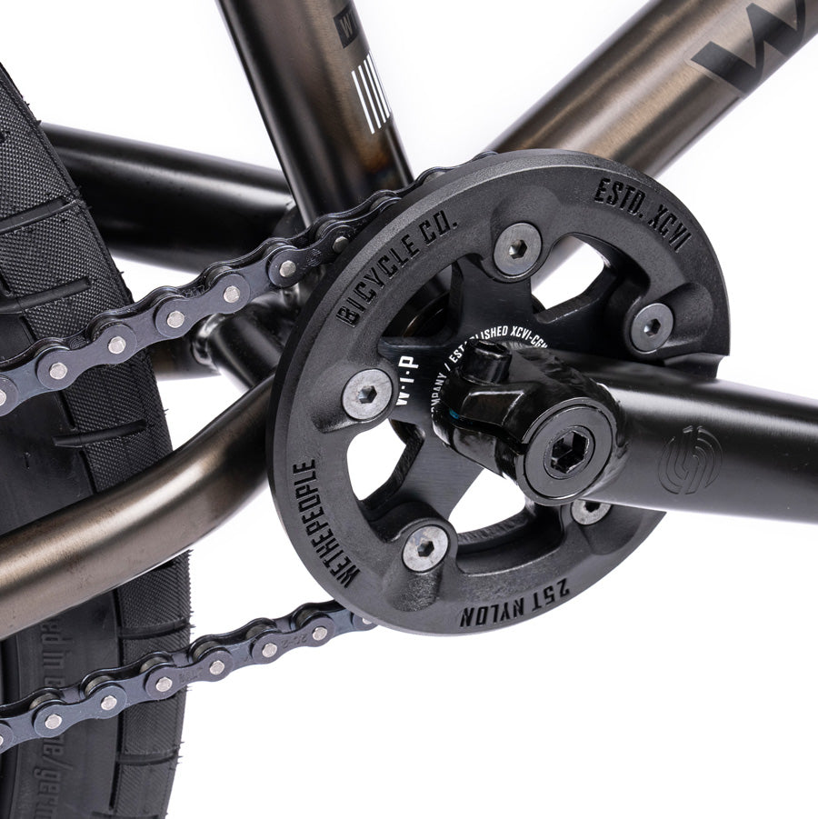 A close up of a Wethepeople Justice 20 BMX Bike chain, an urban machine.